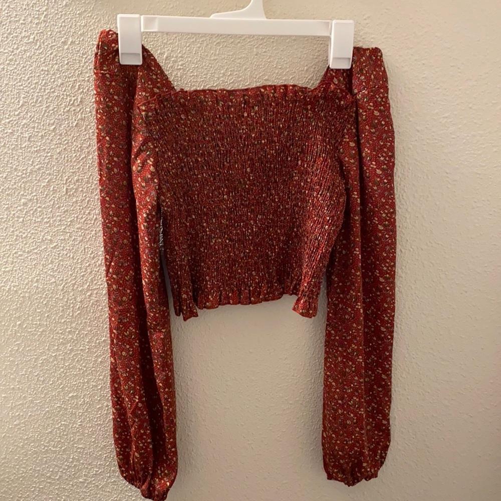Off the shoulder, cropped long sleeve shirt